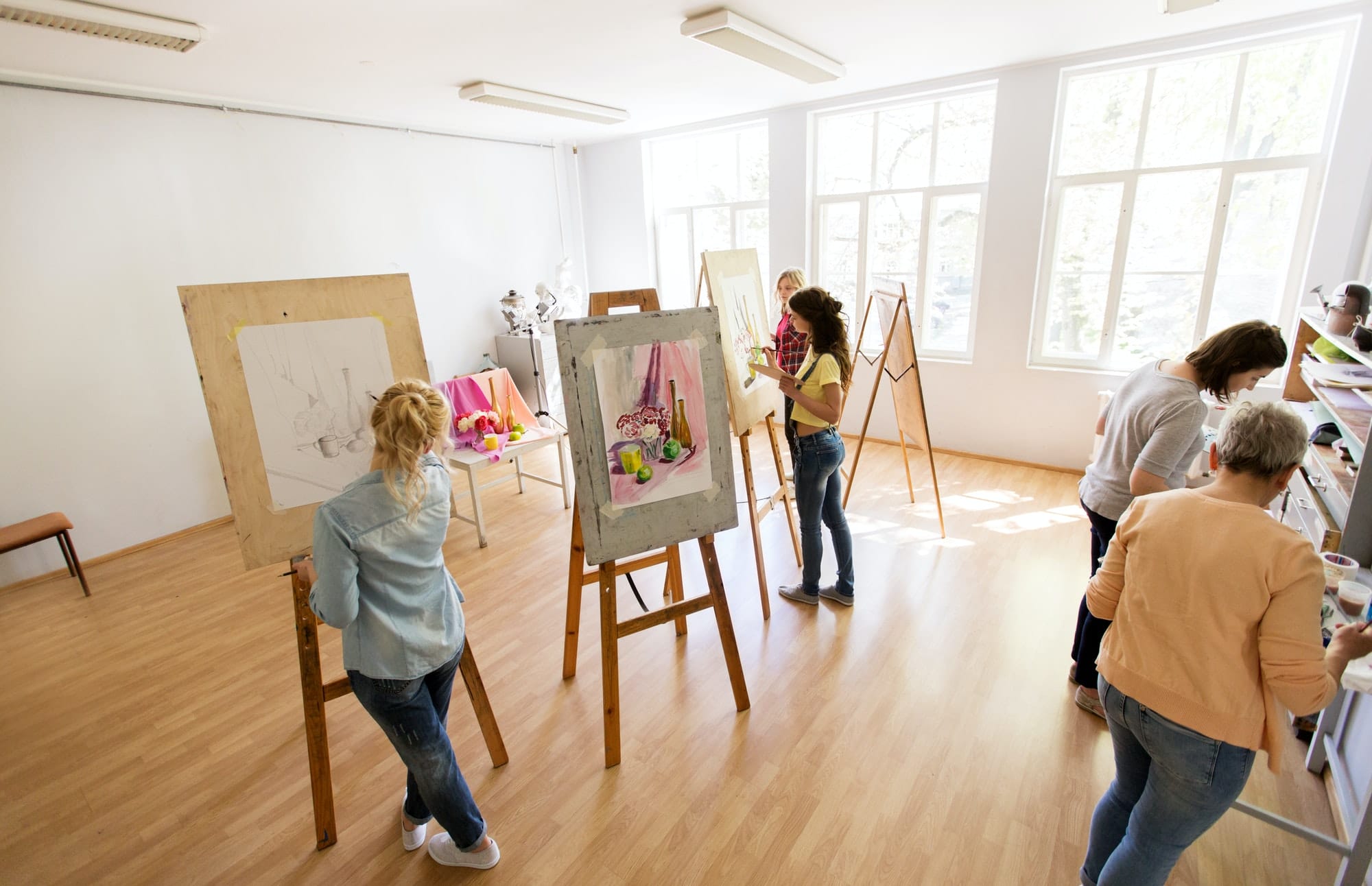 woman-artists-with-brushes-painting-at-art-school.jpg woman-artists-with-brushes-painting-at-art-school.jpg
